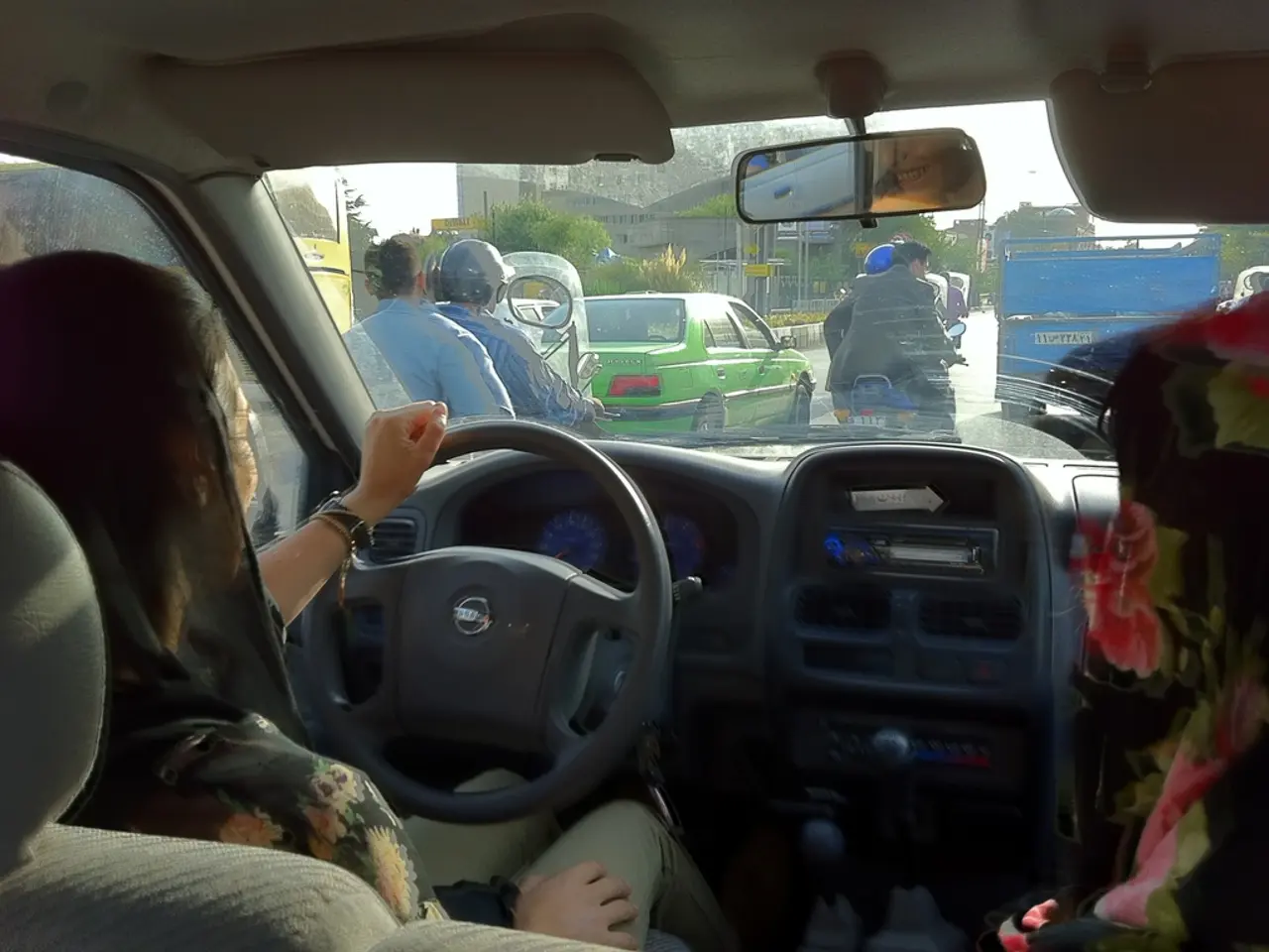 Elderly woman from Kerala tours Dubai streets in Rolls-Royce Ghost car, donning traditional Indian...