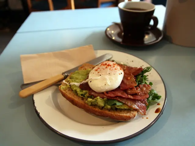 The picture is clicked in a restaurant where on the table there is a coffee cup with saucer below...